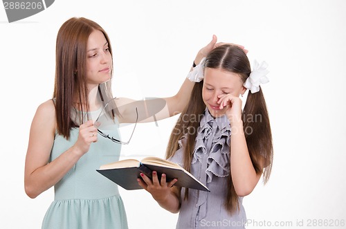 Image of Teacher calms distressed student