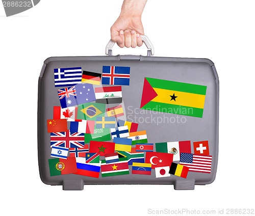 Image of Used plastic suitcase with stickers