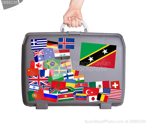 Image of Used plastic suitcase with stickers