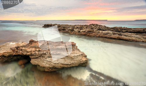 Image of Soft pastel colours of a sunrise at Hyams Beach Australia