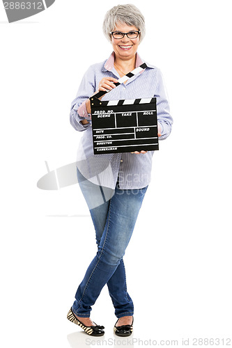 Image of Elderly woman holding a clapboard