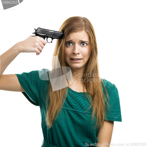 Image of Pointing a gun on herself