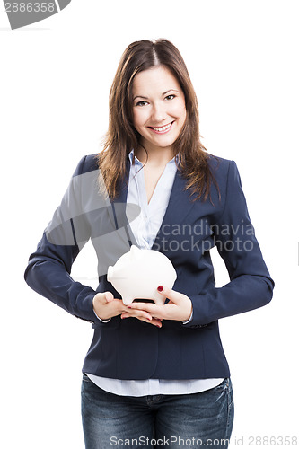 Image of Business woman with a piggy bank