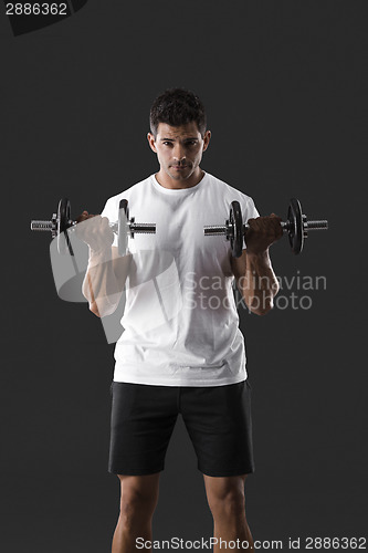 Image of Athletic man lifting weights