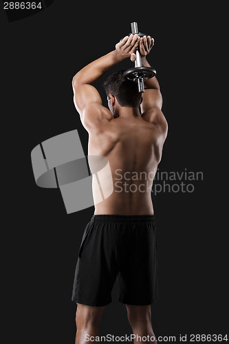 Image of Muscular man lifting weights