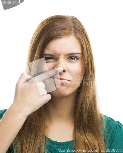 Image of Beautiful young woman touching the nose