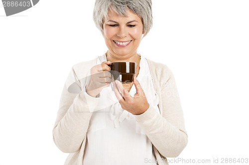 Image of Elderly woman drinking coffee