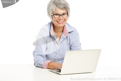 Image of Ellderly woman working with a laptop