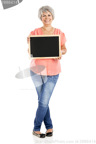 Image of Old woman holding a chalkboard