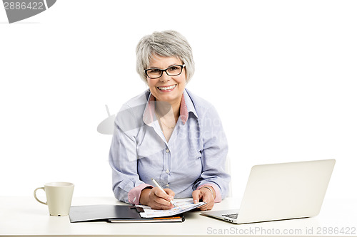 Image of Ellderly woman working with a laptop