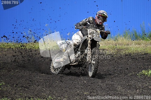 Image of Racers on motorcycles participate in cross-country race competit