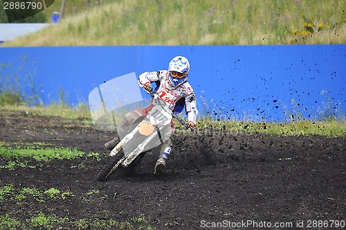 Image of Racers on motorcycles participate in cross-country race competit