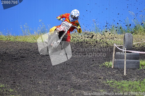 Image of Racers on motorcycles participate in cross-country race competit