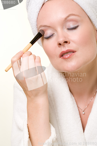 Image of Putting on makeup