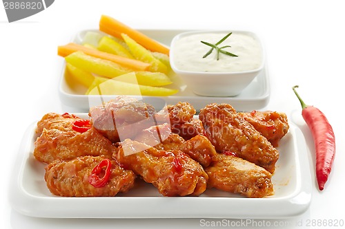 Image of fried chicken wings and vegetables