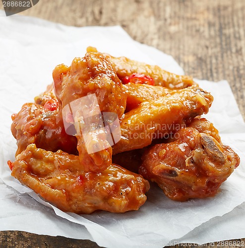 Image of fried chicken wings with sweet chili sauce