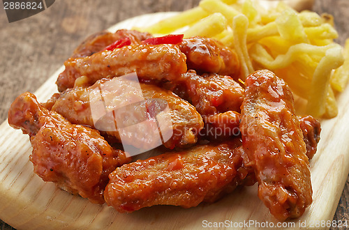 Image of fried chicken wings with sweet chili sauce