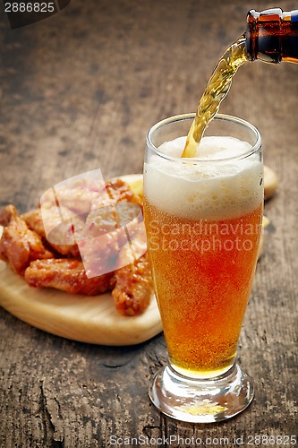 Image of beer pouring into glass