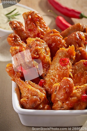 Image of fried chicken wings with sweet chili sauce