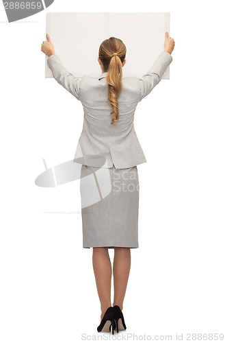 Image of businesswoman or teacher in suit from back