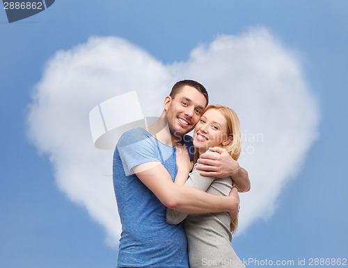 Image of smiling couple hugging