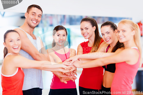 Image of group of people in the gym celebrating victory