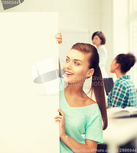 Image of woman with white blank board at school