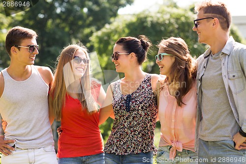 Image of group of smiling friends outdoors