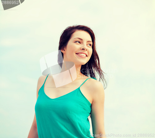 Image of girl standing on the beach