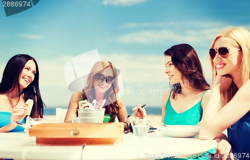 Image of girls in cafe on the beach