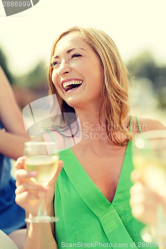 Image of laughing woman with wine glass