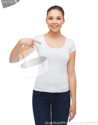 Image of smiling young woman in blank white t-shirt