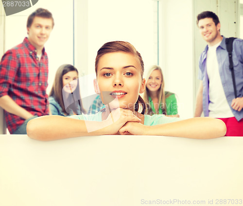 Image of woman with white blank board at school