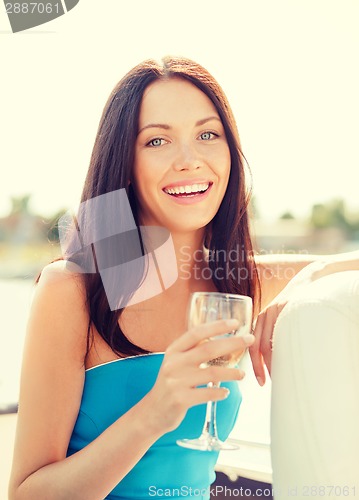 Image of laughing girl with champagne glass