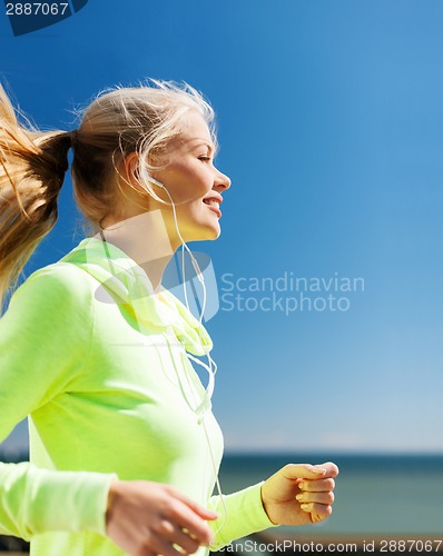 Image of woman doing running outdoors