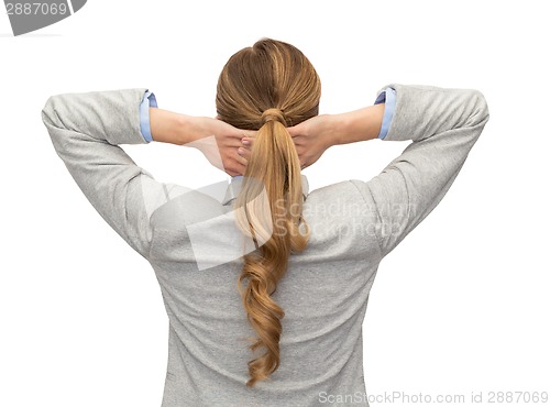 Image of businesswoman or teacher in suit from back