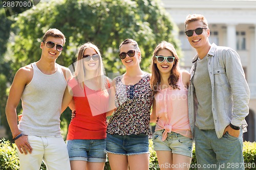 Image of group of smiling friends outdoors