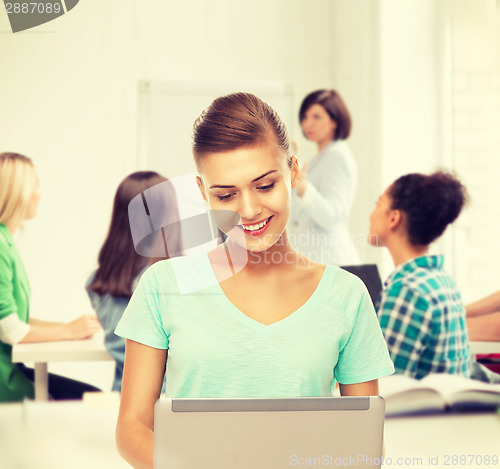 Image of student with laptop at school