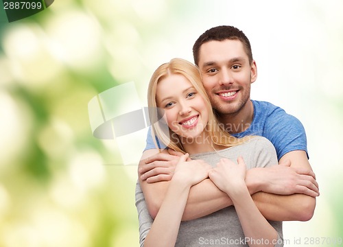 Image of smiling couple hugging