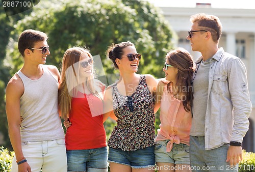 Image of group of smiling friends outdoors