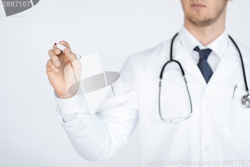 Image of doctor writing something in the air