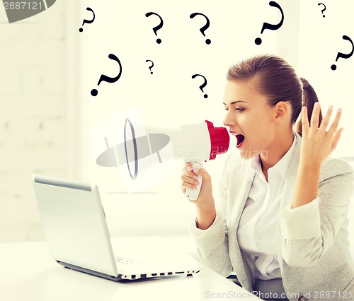 Image of strict businesswoman shouting in megaphone