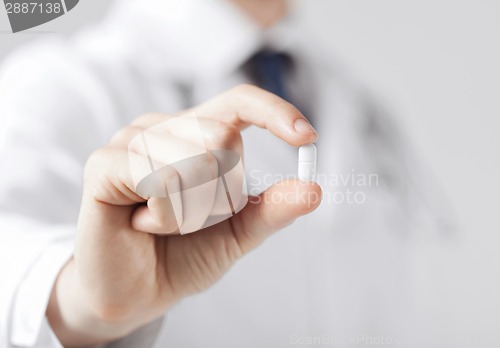 Image of doctor with pill in hospital