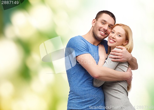 Image of smiling couple hugging