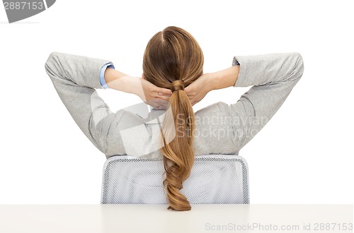 Image of businesswoman sitting on chair from back