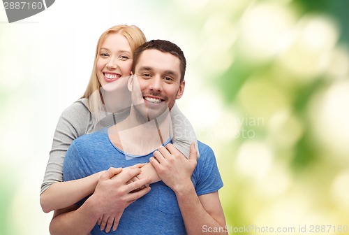 Image of smiling couple hugging