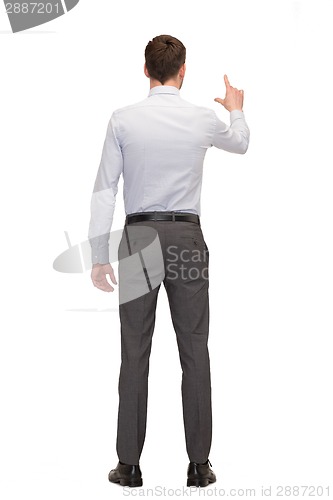 Image of businessman or teacher from back