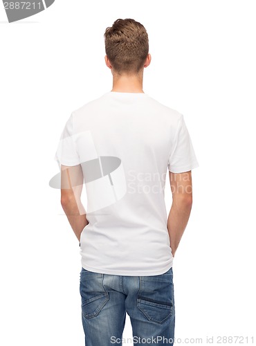 Image of young man in blank white t-shirt from back