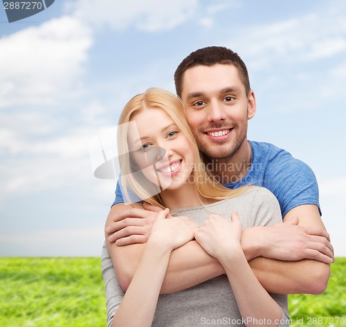 Image of smiling couple hugging