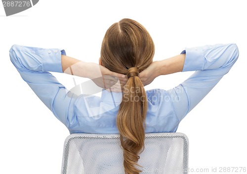 Image of businesswoman sitting on chair from back